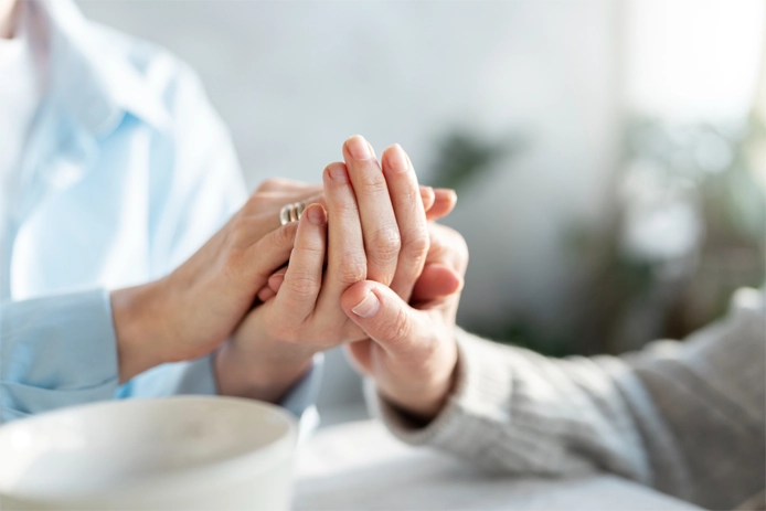 two people holding hands