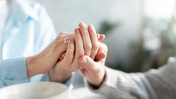 two people holding hands